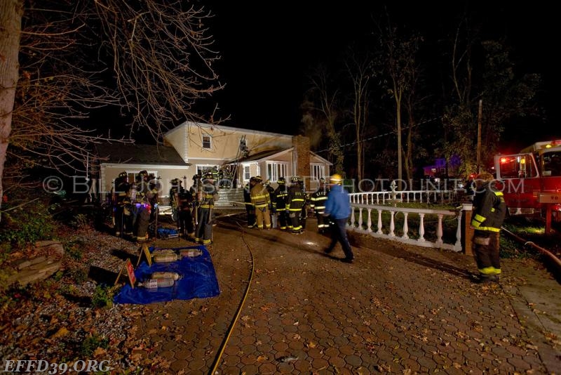 East Fishkill - Chimney Fire that extended into the attic and walls. East Fishkill members worked long hours into night to save home.