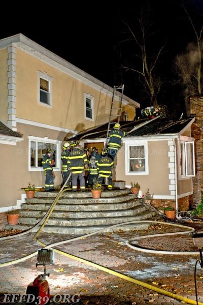 East Fishkill - Chimney Fire that extended into the attic and walls. East Fishkill members worked long hours into night to save home.