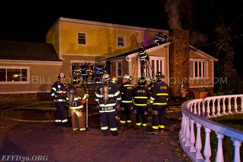 East Fishkill - Chimney Fire that extended into the attic and walls. East Fishkill members worked long hours into night to save home.