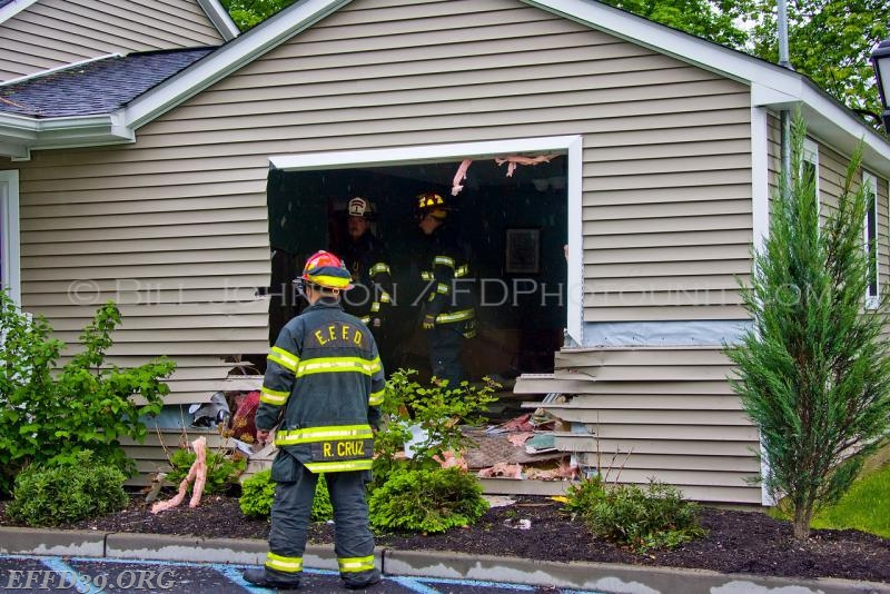 East Fishkill - Members assessing the damage to the Building.  Quick actions from our members person was extricated from vehicale