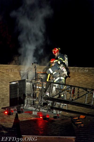 EF members cutting roof 