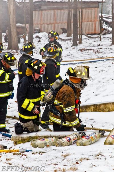 East Fishkill - Members work hard at a stubborn basement fire at a multifamily house. 