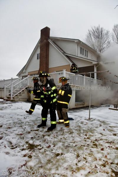 East Fishkill - Members work hard at a stubborn basement fire at a multifamily house. 