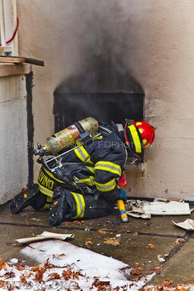 East Fishkill - Members work hard at a stubborn basement fire at a multifamily house. 