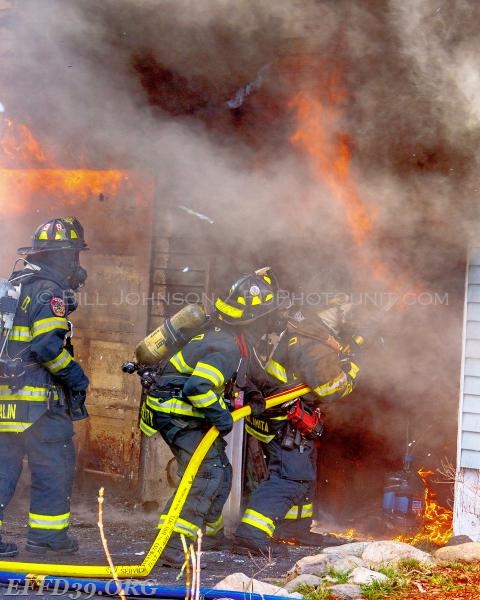 Members make quick knock down of have fire in garage and basement.