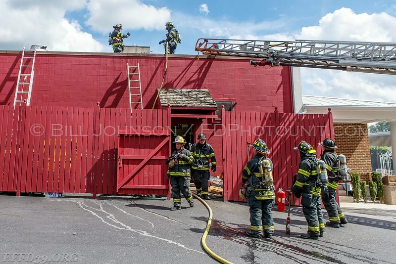 EF Mambers work at fire at village pizza